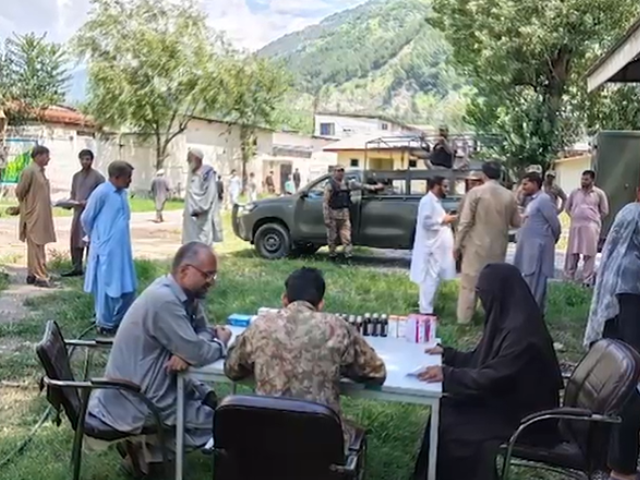 Army medical staff examine patients during a free medical camp. Photo: Express