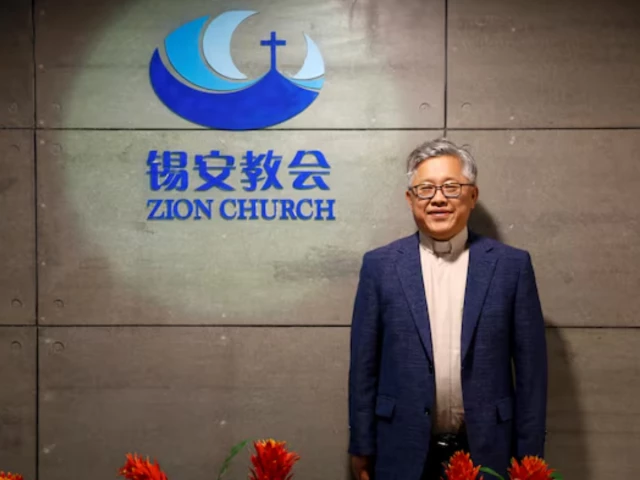 the head pastor of the zion church in beijing jin mingri poses for picures in the lobby of the unofficial protestant house church in beijing china august 28 2018 photo reuters the head pastor of the zion church in beijing jin mingri poses for picures in the lobby of the unofficial protestant house church in beijing china august 28 2018 photo reuters