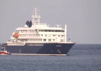 a boat beside cruise ship mv hondius anchored off cape verde port on the day sick passengers were evacuated by boat from the cruise ship in praia port cape verde in this screengrab obtained from a video may 5 2026 photo reuters