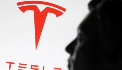 a 3 d printed miniature model of musk and tesla logo photo reuters