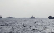 china conducts naval air patrols around disputed south china sea shoal