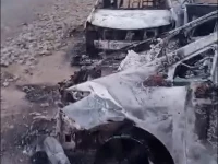 two government cars are destroyed as a result of a terrorist attack on a police station and customs office in dera ismail khan photo screengrab