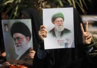 a woman holds an image of iran s late supreme leader ayatollah ali khamenei on the day of an anti israeli and us rally in tehran iran on march 6 2026 photo reuters
