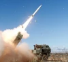 mobile artillery launching a missile photo x