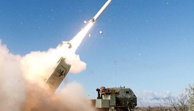 mobile artillery launching a missile photo x