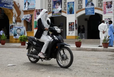 mehwish qureshi 33 an advocate rides on her electric motorcycle in hyderabad pakistan april 2 2026 photo reuters