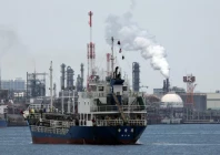 a small tanker sails near an oil refinery in the keihin industrial zone in kawasaki south of tokyo japan march 17 2026 photo reuters