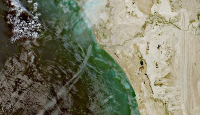 a satellite image shows a fleet of small boats at sea north of the strait of hormuz near the kargan coast iran april 22 2026 photo reuters