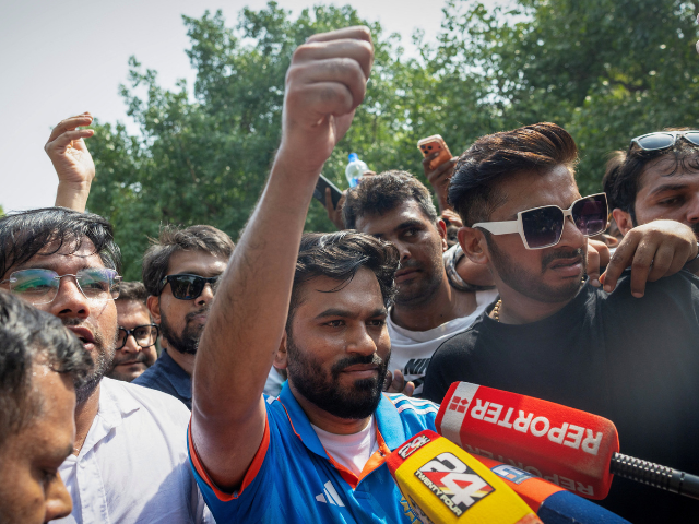 Abhijeet Dipke, head of the Cockroach Janta Party (CJP), gestures towards his supporters after attending a sit-in protest demanding the resignation of Indian Education Minister Dharmendra Pradhan, in New Delhi, India, June 6, 2026. PHOTO: REUTERS