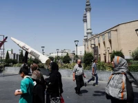 people walk next to a symbolic mock up of an iranian missile on a street in tehran iran june 11 2026 photo reuters