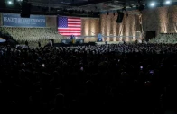 us president donald trump delivers remarks to us troops next to a banner reading peace through strength during a visit to al udeid air base in doha qatar may 15 2025 reuters