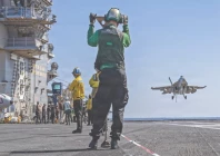 us sailors observing as an f a 18e super hornet aircraft assigned to strike fighter squadron 31 approaches the flight deck of the world s largest aircraft carrier uss gerald r ford photo afp