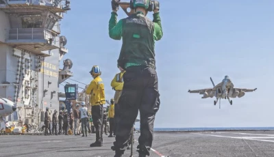 us sailors observing as an f a 18e super hornet aircraft assigned to strike fighter squadron 31 approaches the flight deck of the world s largest aircraft carrier uss gerald r ford photo afp