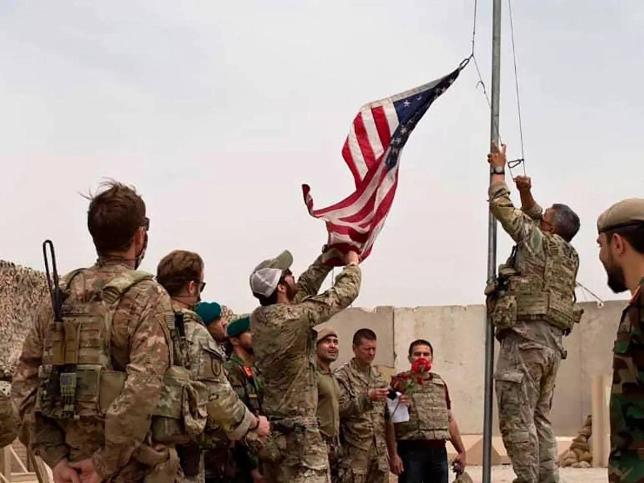 us soldiers lower the us flag in afghanistan as the taliban claim control of kabul photo afp us soldiers lower the us flag in afghanistan as the taliban claim control of kabul photo afp