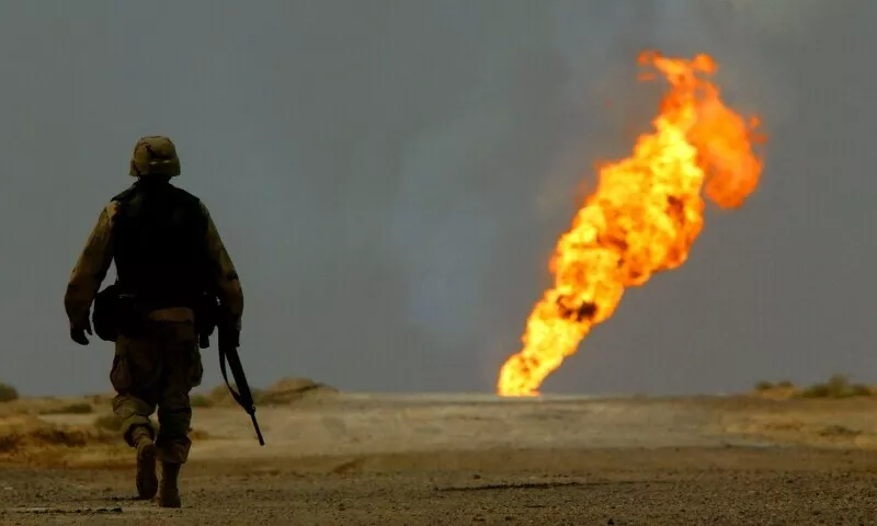 a us army soldier walks towards a burning oil well in iraq s vast southern rumaila oilfields march 30 2003 photo reuters a us army soldier walks towards a burning oil well in iraq s vast southern rumaila oilfields march 30 2003 photo reuters