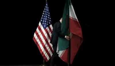 a staff member removes the iranian flag from the stage after a group picture with foreign ministers and representatives of the us iran china russia britain germany france and the european union during iran nuclear talks at the vienna international centre in vienna austria on july 14 2015 file photo reuters
