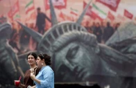 people walk past an anti us billboard on a street in tehran iran august 3 2026 photo reuters file