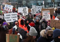 people shout slogans as they gather at a makeshift memorial at the site where a man identified as alex pretti was fatally shot by federal immigration agents trying to detain him in minneapolis minnesota us photo reuters