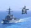 uss donald cook ddg 75 transits the arabian sea while an mh 60s sea hawk flies nearby on july 19 2026 photo us central command uss donald cook ddg 75 transits the arabian sea while an mh 60s sea hawk flies nearby on july 19 2026 photo us central command