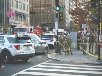 national guard soldiers gather near a crime scene after a shooting in downtown washington dc photo afp