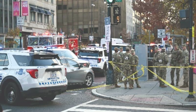 national guard soldiers gather near a crime scene after a shooting in downtown washington dc photo afp