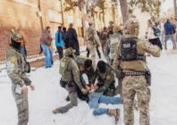 people confront members of law enforcement leaving the scene where a driver was shot by a us immigration agent according to local and federal officials in minneapolis minn on jan 7 2026 photo reuters