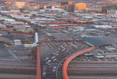 vehicles waiting in line to cross into the us via the paso del norte international bridge on the first day of a partial us government shutdown as seen from ciudad juarez mexico photo reuters
