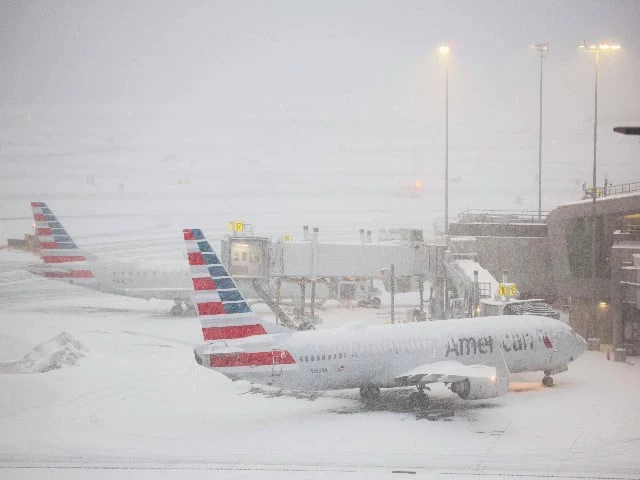 a boeing 737 american airlines passenger aircraft is parked at gate on the tarmac of laguardia airport in new york amid snowfall photo afp a boeing 737 american airlines passenger aircraft is parked at gate on the tarmac of laguardia airport in new york amid snowfall photo afp