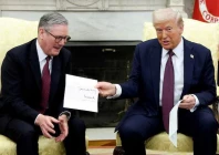 us president donald trump holds a letter from britain s king charles as he meets with british prime minister keir starmer in the oval office at the white house in washington dc us photo reuters