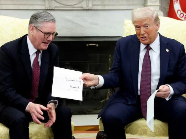 us president donald trump holds a letter from britain s king charles as he meets with british prime minister keir starmer in the oval office at the white house in washington dc us photo reuters