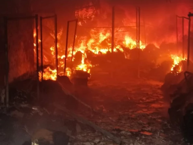 flames engulf a fabric shop near bara market in north karachi photo express