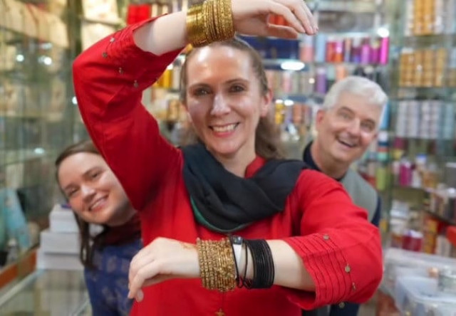 at the bustling market consul general conrad tribble and diplomats heather and anna maria enthusiastically joined fellow shoppers in selecting colourful earrings sparkly bangles and beautiful shoes for themselves and their loved ones screengrab