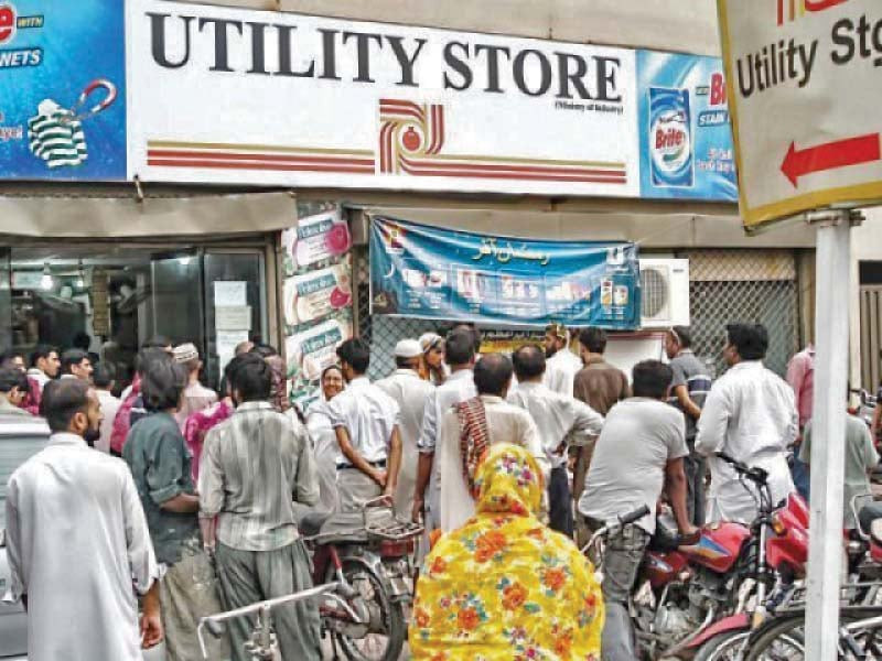 buyers wait outside a utility store to purchase goods discounted in ramazan offer