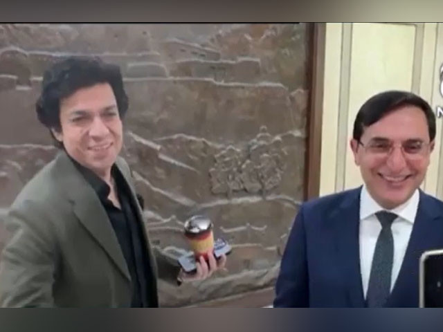 faisal vawda and pti chairman barrister gohar ali khan shared a light hearted exchange while crossing paths in parliament house on december 11 2024 screengrab