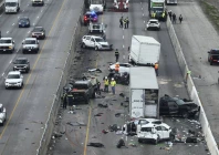 officials examine the aftermath of a fatal crash on i 35 southbound near parmer lane photo courtesy ap