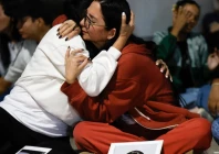 a photo of two venezuelan s embracing photo afp a photo of two venezuelan s embracing photo afp