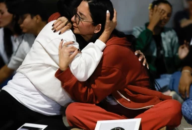 a photo of two venezuelan s embracing photo afp