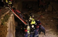 members of ecuadorian ecu 11 guayaquil fire department and portuguese firefighters recover the body of a casualty from a building that collapsed from the ground floor to the fifth floor following major earthquakes in la guaira venezuela june 29 2026 reuters