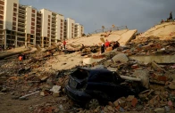 a damaged vehicle lies amid rubble as rescue operations continue after earthquakes hit the country in la guaira venezuela june 27 2026 photo reuters