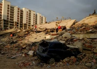 a damaged vehicle lies amid rubble as rescue operations continue after earthquakes hit the country in la guaira venezuela june 27 2026 photo reuters
