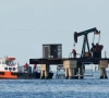 workers of venezuelan state oil company pdvsa labour at an operating pumpjack in lake maracaibo in cabimas venezuela january 27 2026 photo reuters