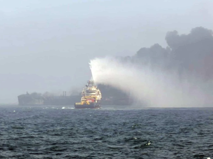 handout photo of black smoke billowing into the air after a crash between an oil tanker and a cargo ship off the coast of east yorkshire photo ap