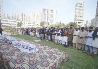 family friends and community members offer janaza of four victims of the deadly gul plaza blaze at the eidgah ground in delhi colony on sunday after their remains were identified by dna matching photo ppi