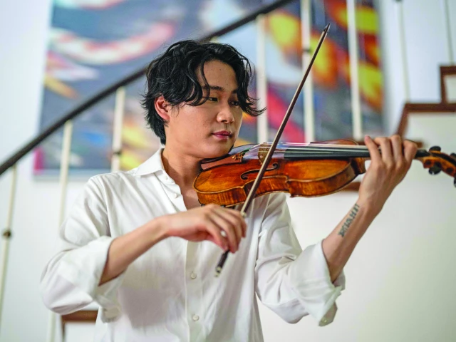berlin based south korean violinist inmo yang plays the carrodus violin in berlin germany on august 18 2025 a rare violin one of the most valuable in the world crafted by an italian violin maker three centuries ago is to be played for the first time as part of the bbc proms by south korean violinist inmo yang photo afp