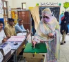 a woman votes during the second phase of the azad jammu and kashmir ajk legislative assembly elections at a polling station in muzaffarabad on august 2 2026 picture taken with a mobile phone photo reuters