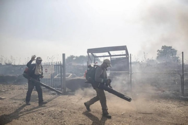 firefighters conduct extinguishing work after fire broke out in 15 places in northern israel due to missiles fired from lebanon and shrapnel falling during blocking operations at golan heights in israel on june 13 2024 firefighters conduct extinguishing work after fire broke out in 15 places in northern israel due to missiles fired from lebanon and shrapnel falling during blocking operations at golan heights in israel on june 13 2024