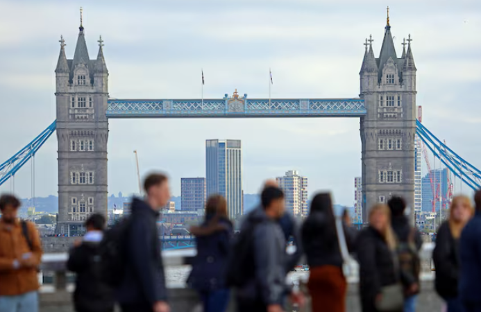 people walk over london bridge looking at a view of tower bridge in the city of london financial district in london britain october 25 2023 photo reuters