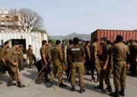 police officers guard a street where shipping containers have been used to block the road leading towards the red zone and parliament building in islamabad on april 3 2022 photo reuters police officers guard a street where shipping containers have been used to block the road leading towards the red zone and parliament building in islamabad on april 3 2022 photo reuters