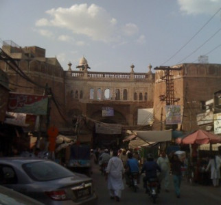 an iron gate to a city of dreams