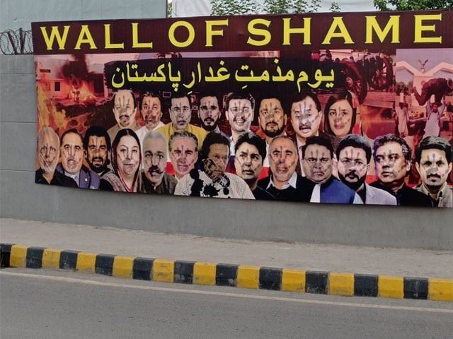 these walls of shame bear banners that read wall of shame and day of condemnation of traitors of pakistan accompanied by shoe marks on pictures of khan and other party leaders photo express